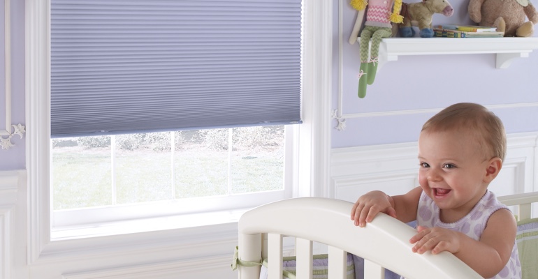 Tampa infant's nursery with cellular shades.